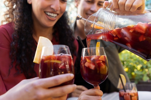 Side view smiley friends with drinks