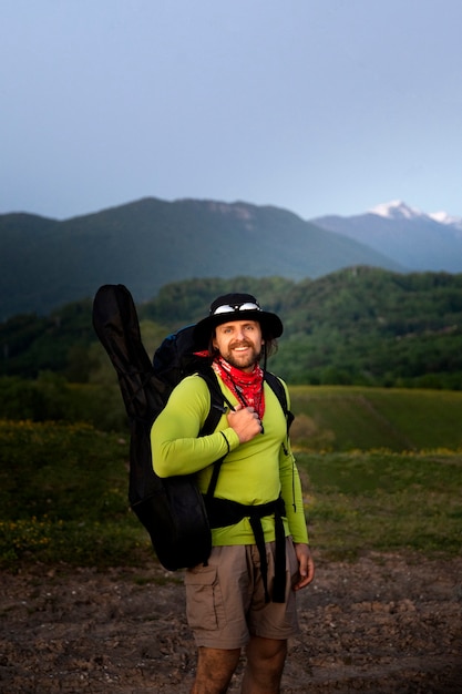 Side view smiley man camping