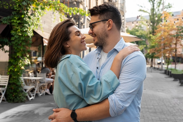 Side view smiley romantic couple