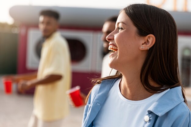 Side view smiley woman at party