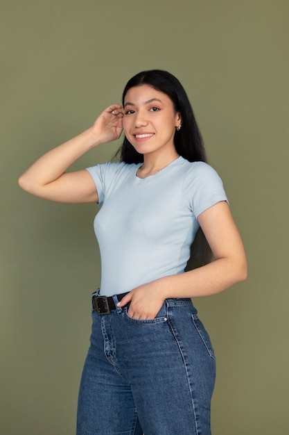 Side view smiley woman posing in studio