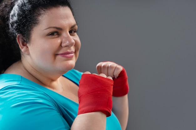 Free photo side view smiley woman training