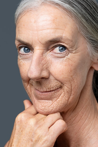 Side view smiley woman with blue eyes