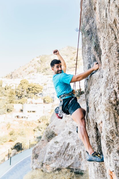 Side view of smiling climber