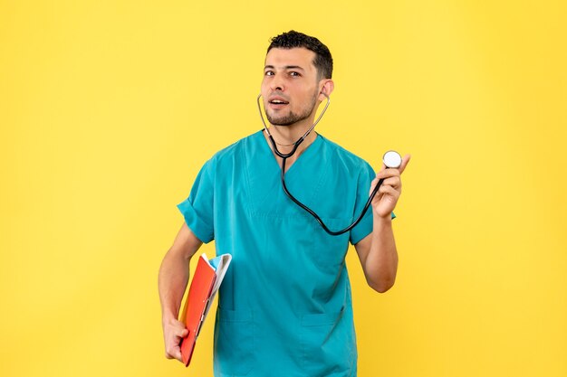 Side view specialist a doctor listens to complaints of patients with coronavirus