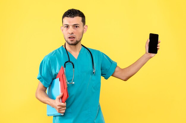 Side view specialist a doctor with documents shows the phone