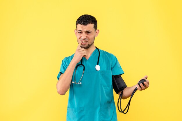 Side view specialist a doctor with tonometer is thinking about his patients