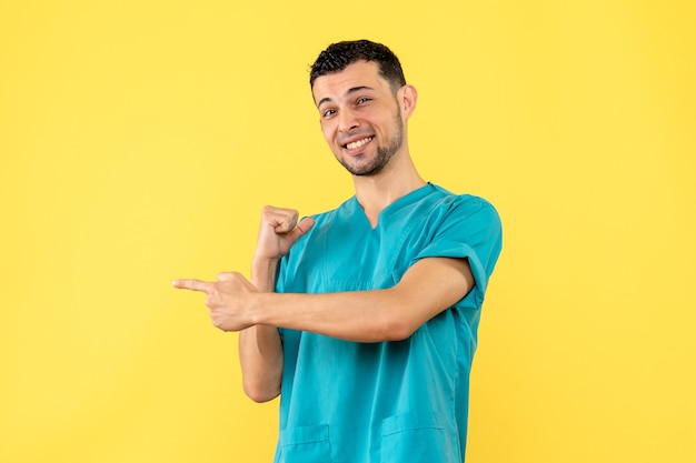 Side view a specialist smiling doctor cured a patient whose finger hurt