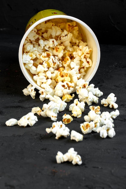 Side view sprinkled bucket with popcorn