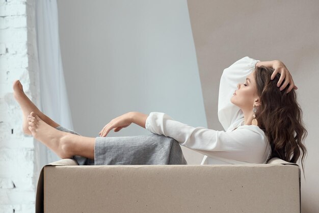 Side view of stunning girl with closed eyes posing on camera