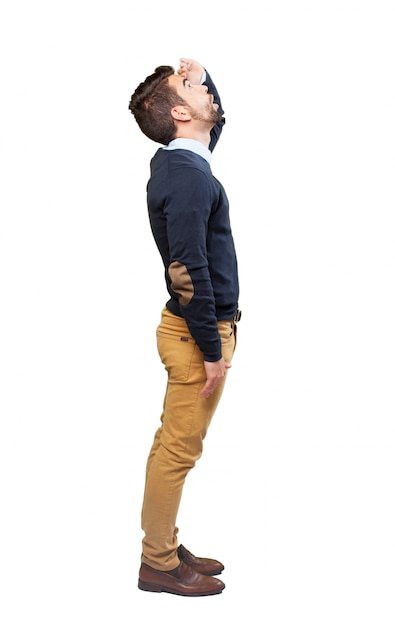 Side view of stylish teenage boy looking up