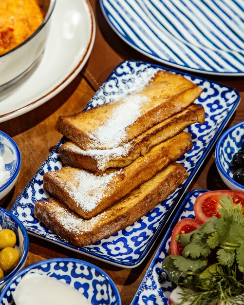 Side view of tasty toasted bread on the table