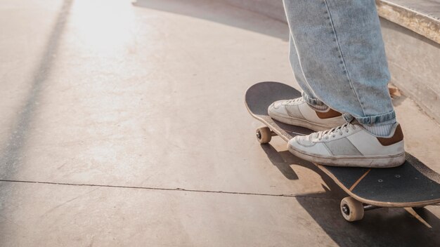 Side view of teenager at the skatepark with copy space