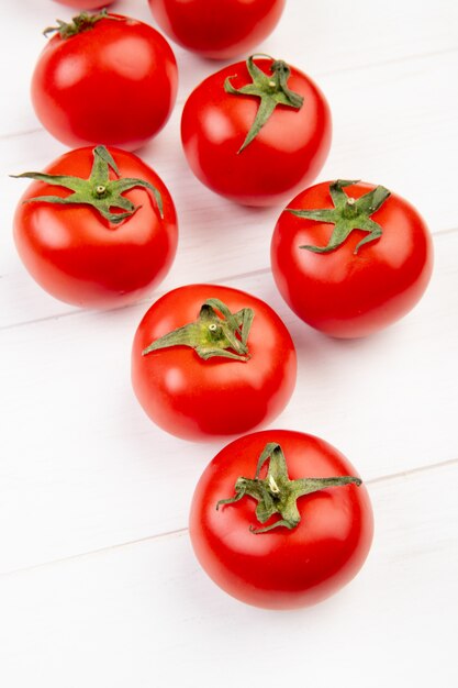 Side view of tomatoes on wooden table