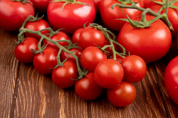 Side view of tomatoes on wooden table