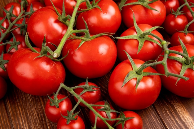 Side view of tomatoes on wooden table