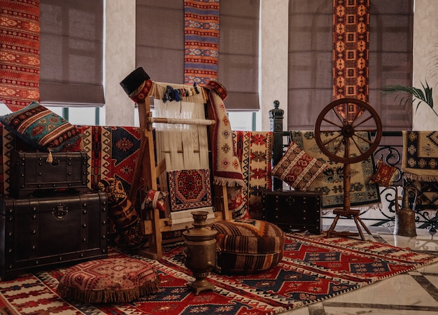 Side view of a traditional rug being woven on a carpet vertical loom oriental wall