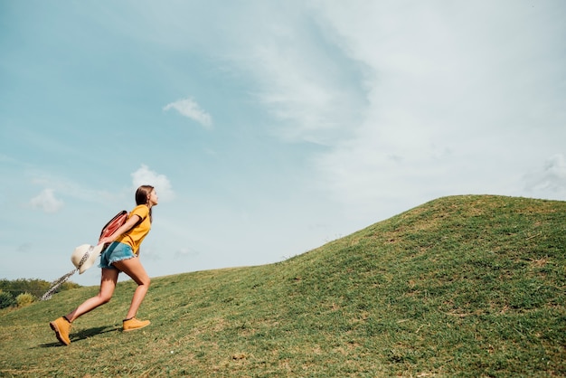 Side view of traveler going uphill