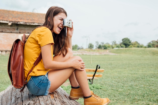 Side view of traveler taking a photo