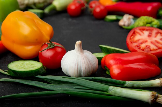 Side view of vegetables on black background