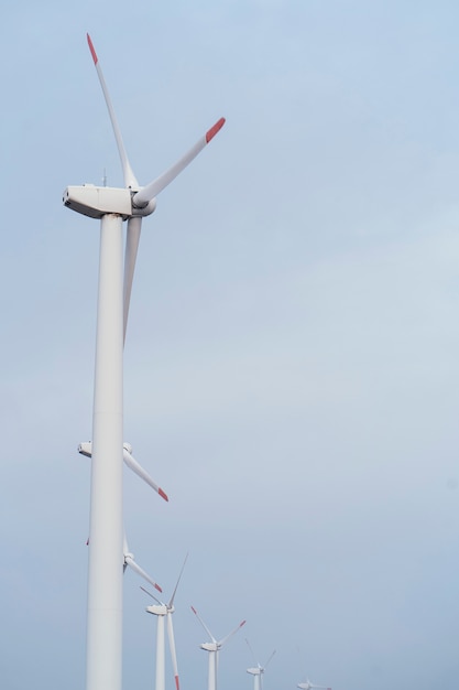 Side view of wind turbines generating energy