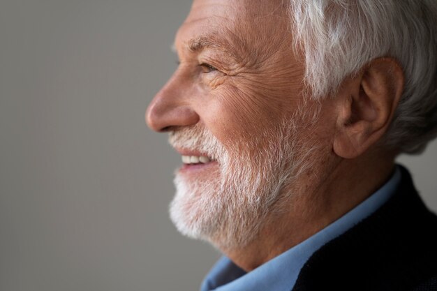 Side view wise man posing in studio