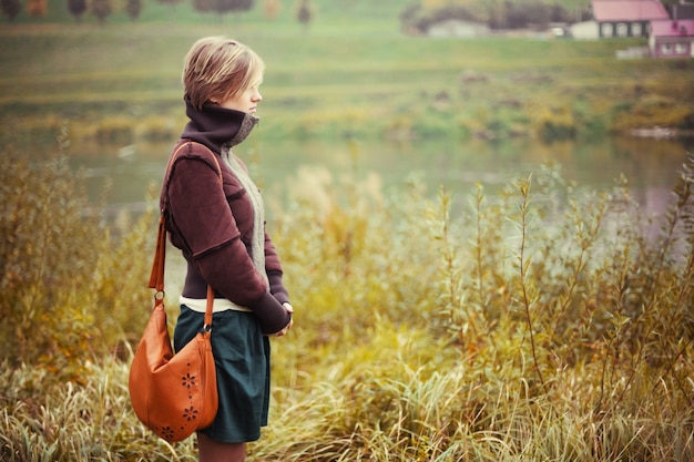 Free photo side view of woman admiring nature