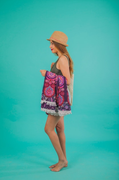 Side view of woman in beachwear standing