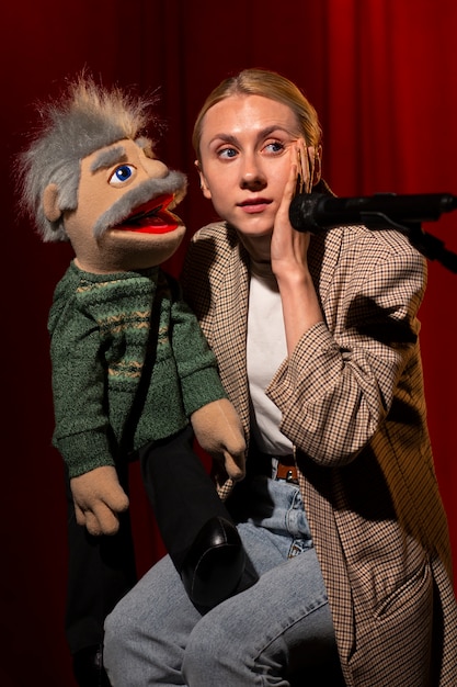 Side view woman being ventriloquist