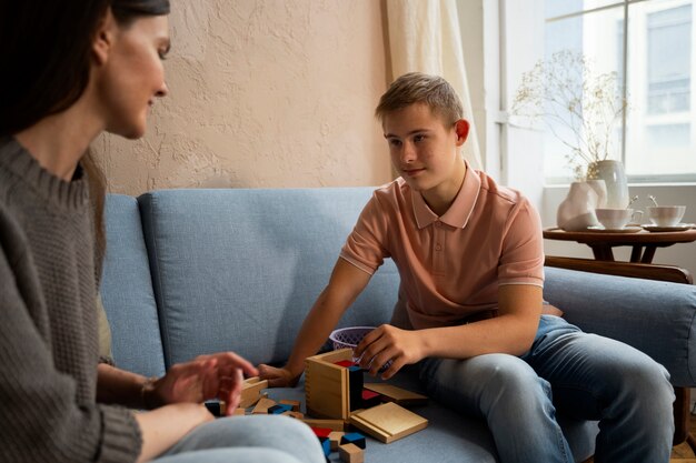 Side view woman and boy sitting on couch