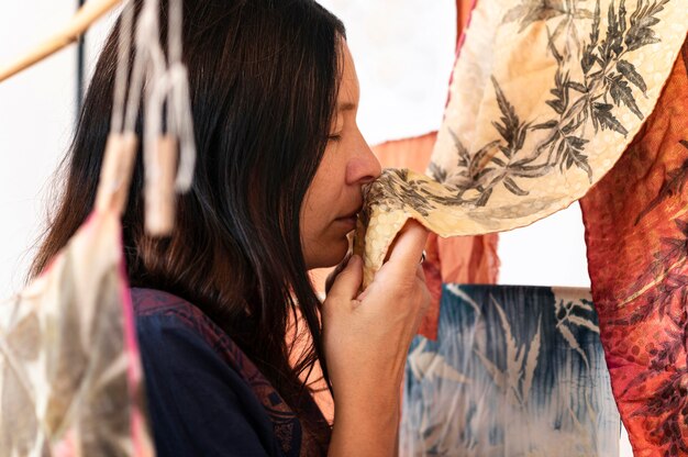 Side view woman checking natural pigmented cloths