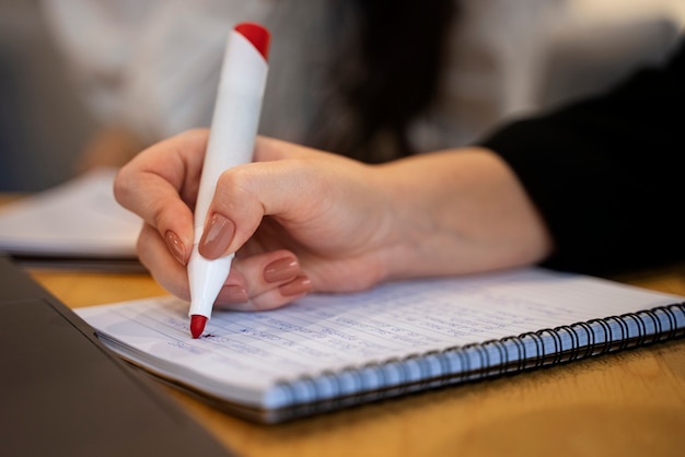 Side view woman correcting grammar mistakes