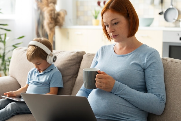 Side view woman on couch with kid