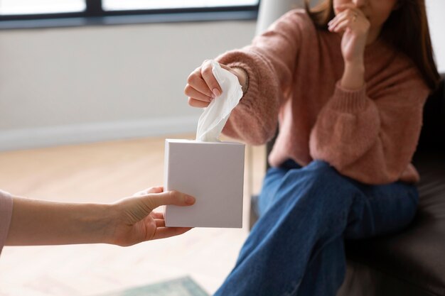 Side view woman crying in therapy