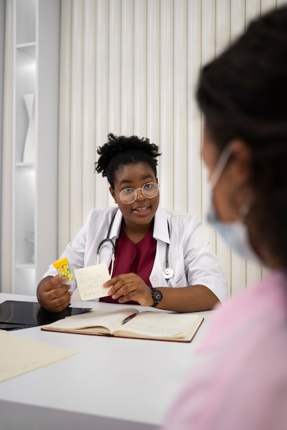 Side view woman at doctor's appointment