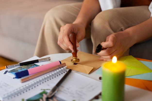 Free photo side view woman doing creative journaling