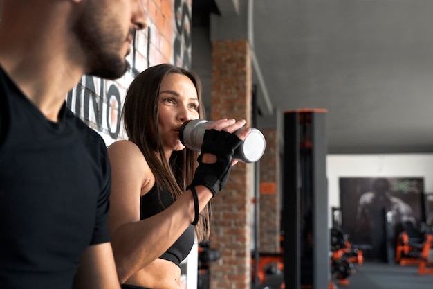 Side view woman drinking water