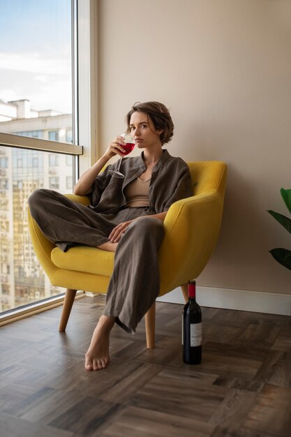 Side view woman drinking wine