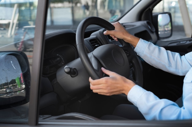 Side view woman driving van