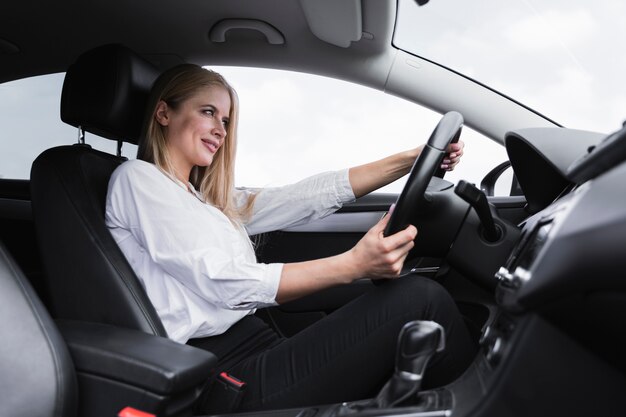 Side view of woman driving