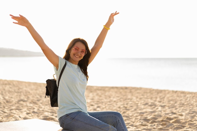 Side view of woman enjoying the beach