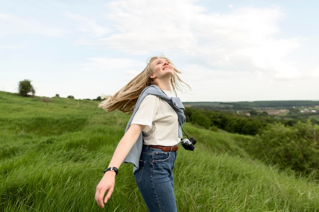 Side view of woman enjoying nature and fresh air