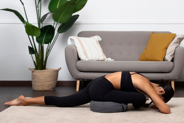 Side view woman exercising indoors