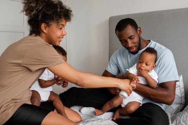 Side view woman feeding baby