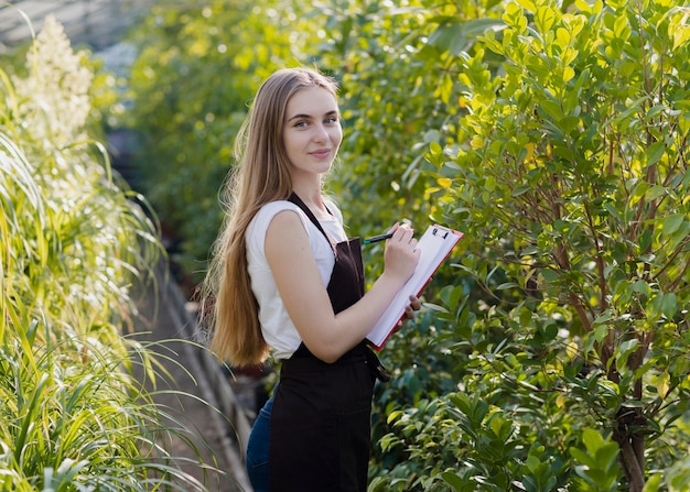 Side view woman between foliage