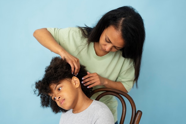 Side view woman helping kid