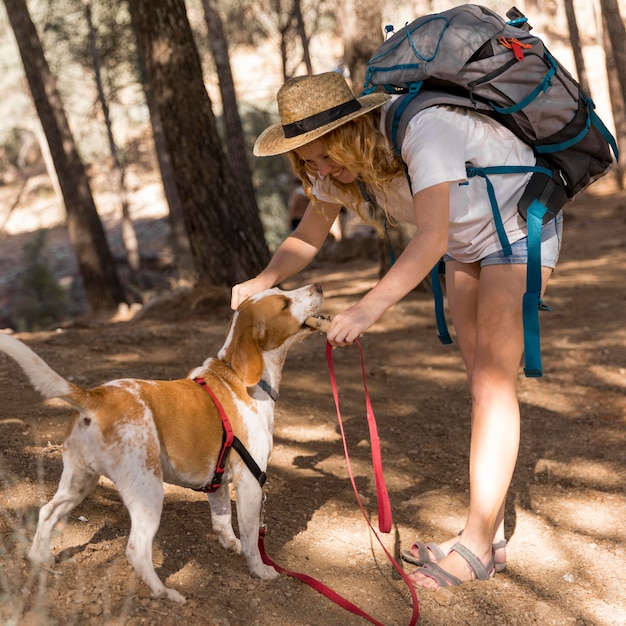 Side view woman and her dog having a good time