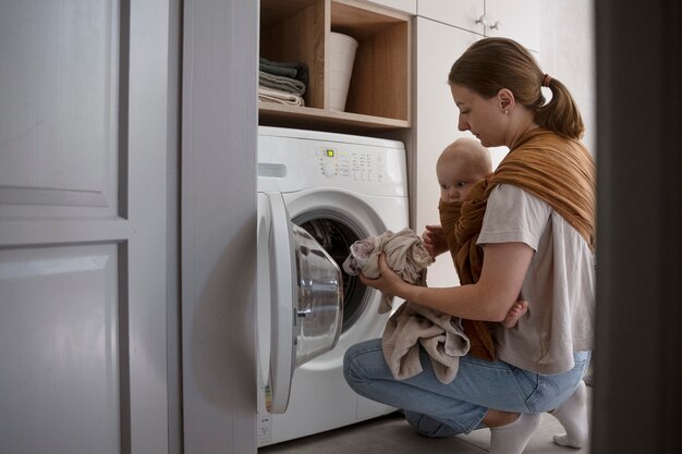 Side view woman holding baby