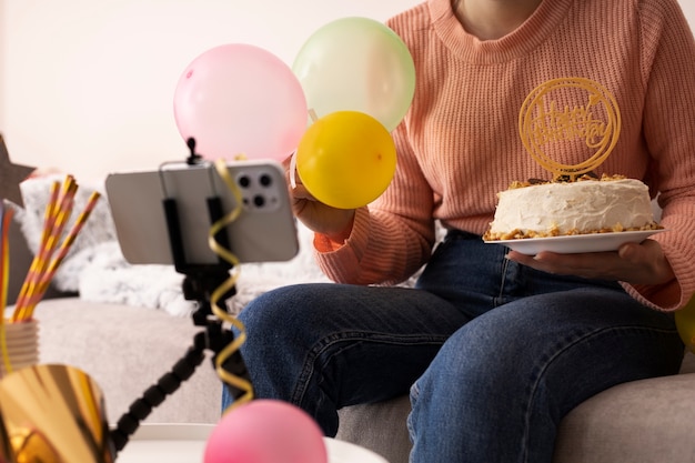 Side view woman holding cake