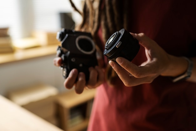 Side view woman holding camera